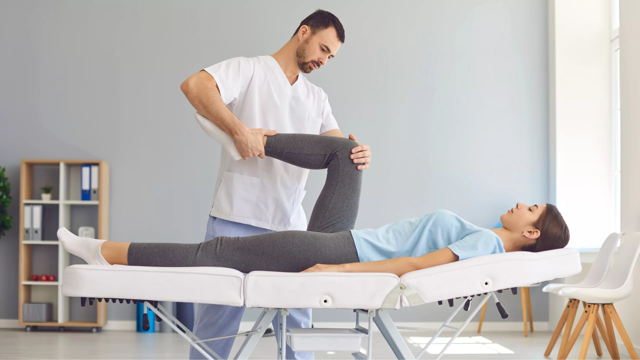 Man receiving physiotherapy treatment by a physiotherapist