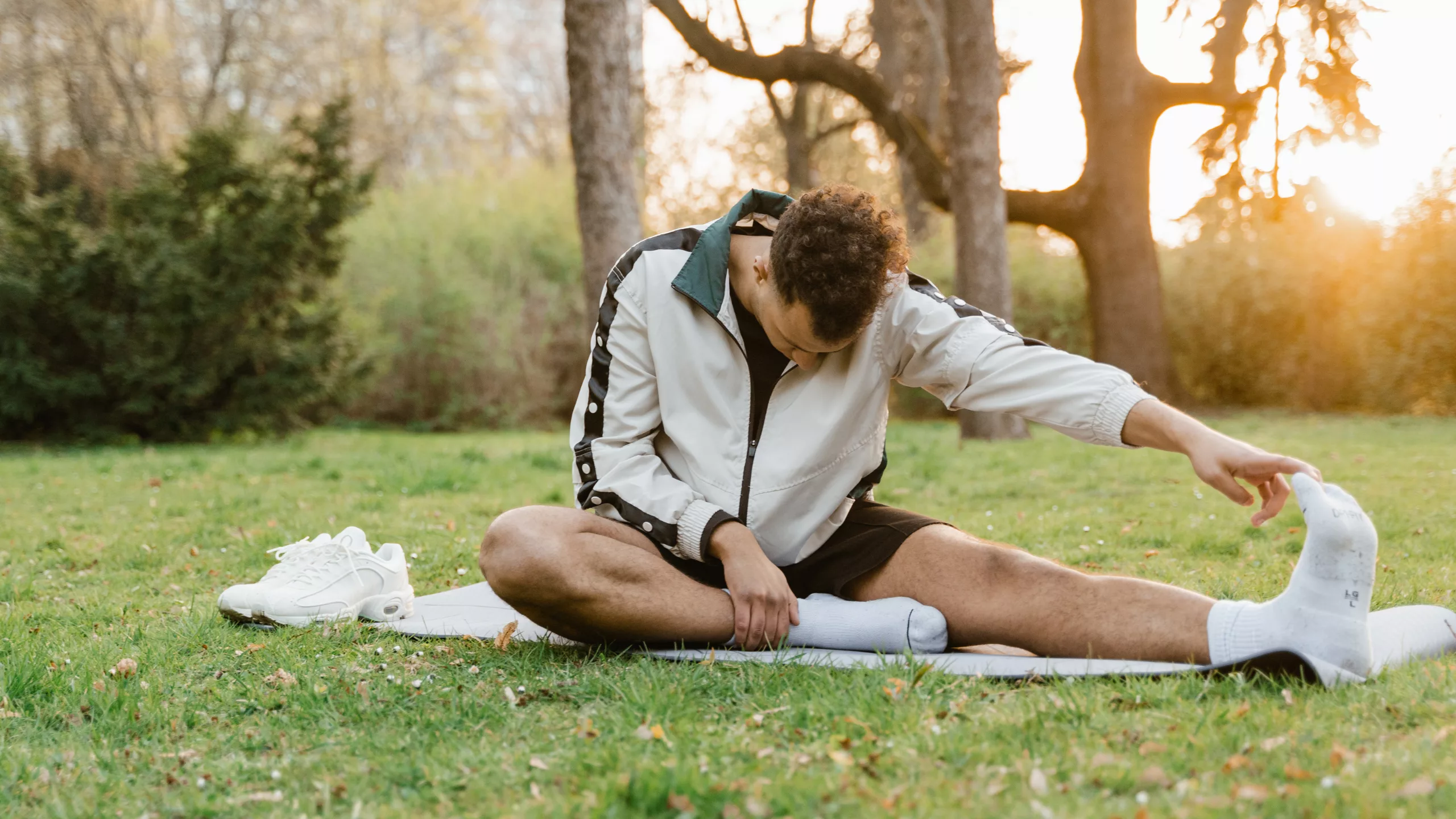 Man doing yoga exercises in the park
